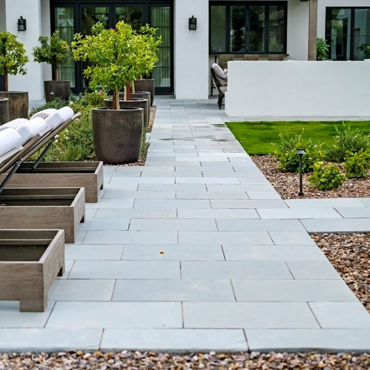 Caribbean Blue Limestone Wall Cap shown installed in a finished outdoor or living space
