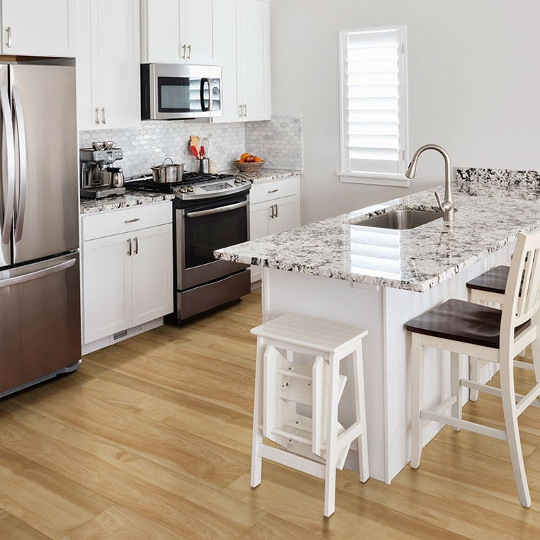 Cyrus Brookline rigid core SPC vinyl plank flooring installed in a furnished room