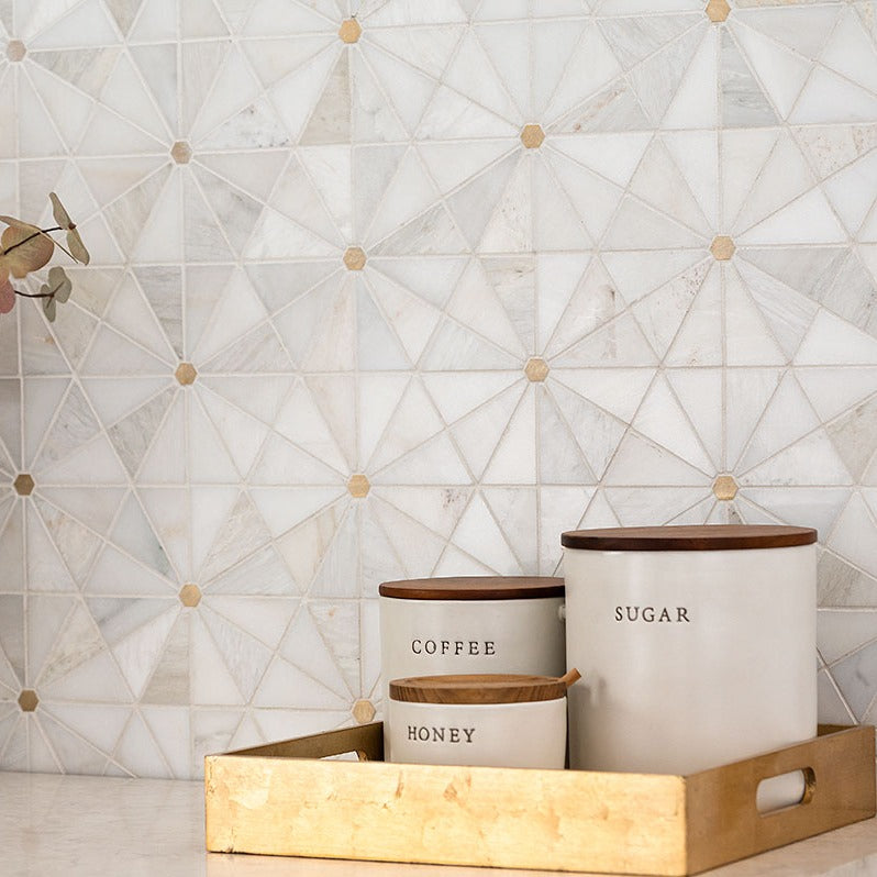 Elegante Pinwheel Gold Stone and Metal Mosaic installed in a finished room