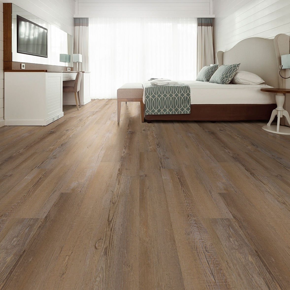 Glenridge Lime Washed Oak glue down vinyl plank flooring installed in a furnished room
