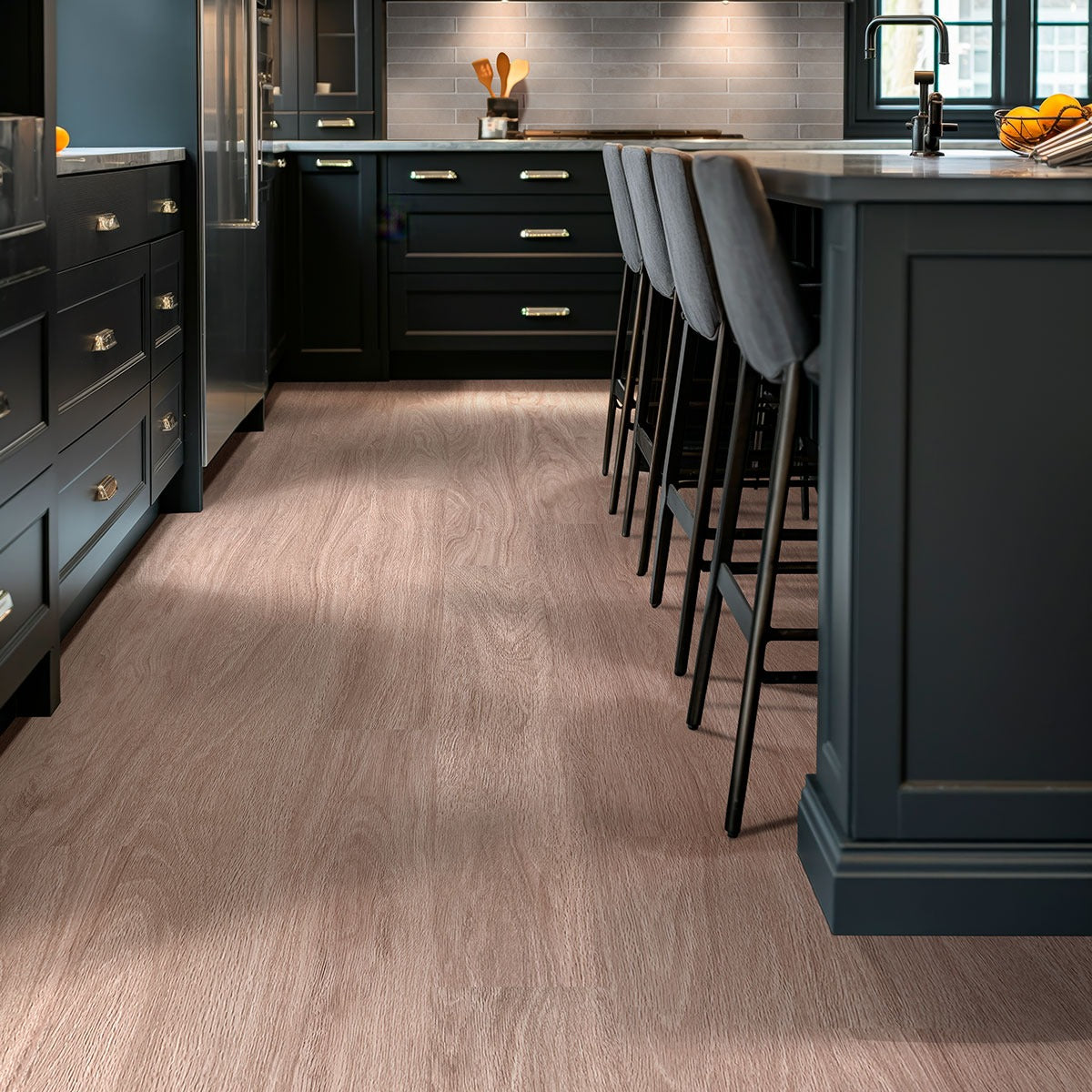 Kallum Bleached Elm loose lay vinyl plank flooring installed in a furnished room