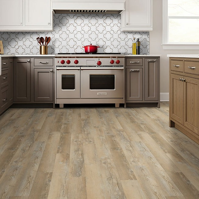 Katavia Lime Washed Oak glue down vinyl plank flooring installed in a kitchen