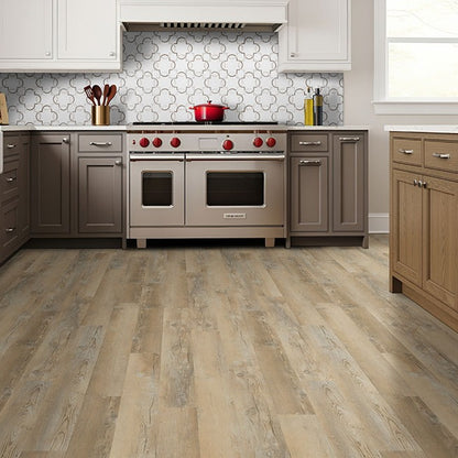 Katavia Lime Washed Oak glue down vinyl plank flooring installed in a kitchen