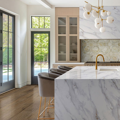 Calacatta Castana Q Plus quartz kitchen countertop installed in a room setting
