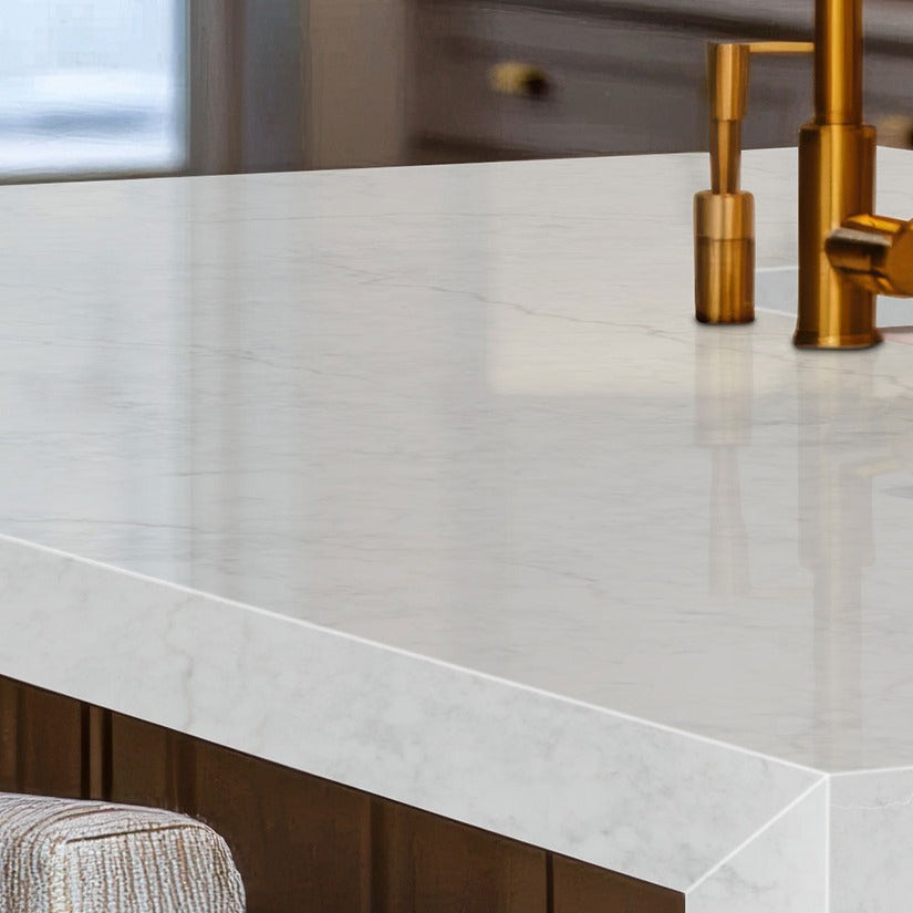 Calacatta Miraggio Lusso LumaLuxe Ultra quartz kitchen countertop installed in a room setting