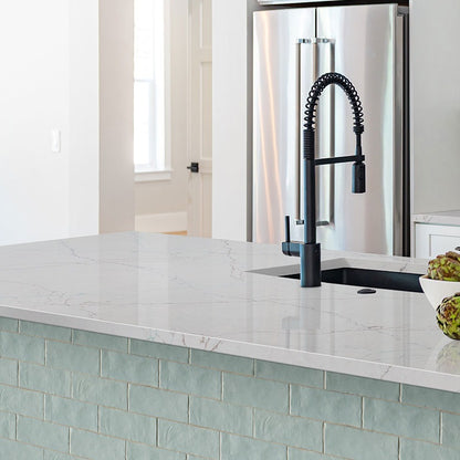 Calacatta Miraggio SeaGlass LumaLuxe Ultra quartz kitchen countertop installed in a room setting