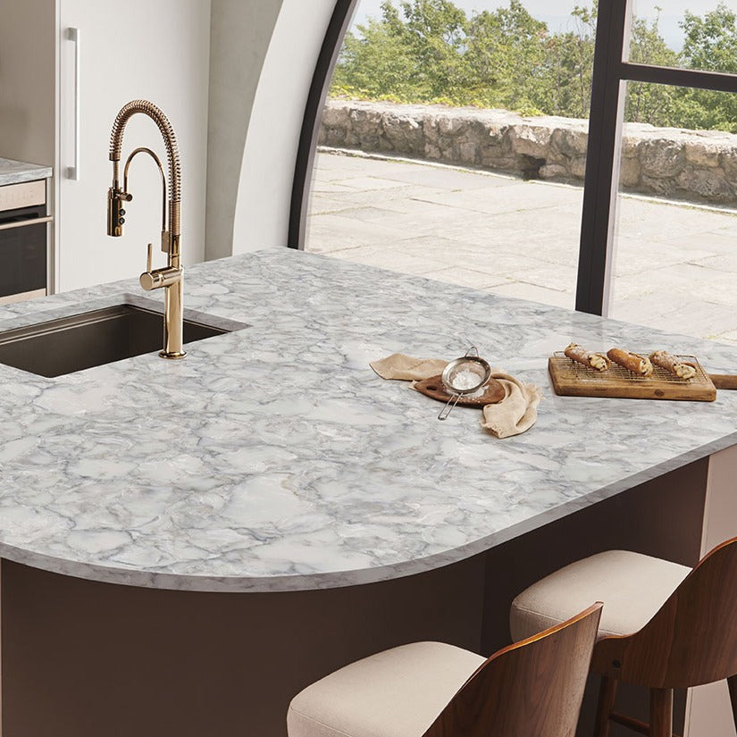 Calacatta Ocellio LumaLuxe quartz kitchen countertop installed in a room setting