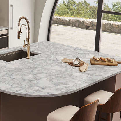Calacatta Ocellio LumaLuxe quartz kitchen countertop installed in a room setting