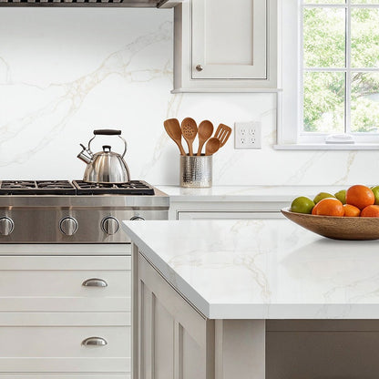 Calacatta Rivessa quartz kitchen countertop installed in a room setting