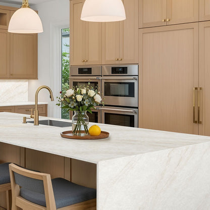 IvoriTaj Brushed Q Plus quartz kitchen countertop installed in a room setting