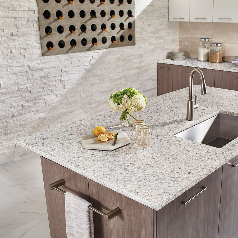 White Ornamental granite countertop installed in a kitchen