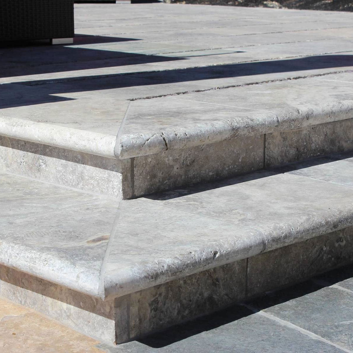 Silver Travertine Pool Coping shown installed in a finished outdoor or living space
