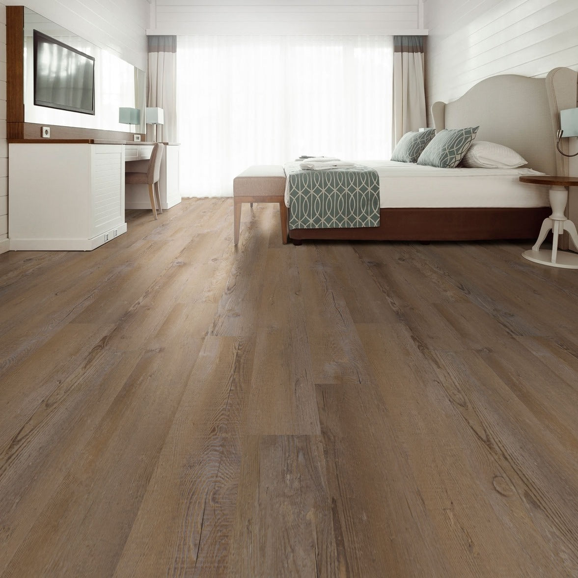 Wilmont Lime Washed Oak glue down luxury vinyl flooring shown in a furnished room