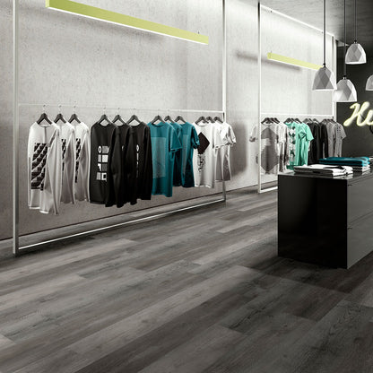 Wilmont Woodrift Gray glue down luxury vinyl flooring shown in a furnished room