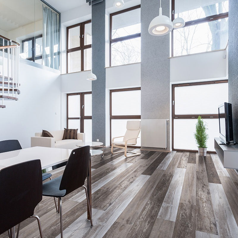 XL Cyrus Weathered Brina SPC rigid core vinyl flooring shown in a furnished room