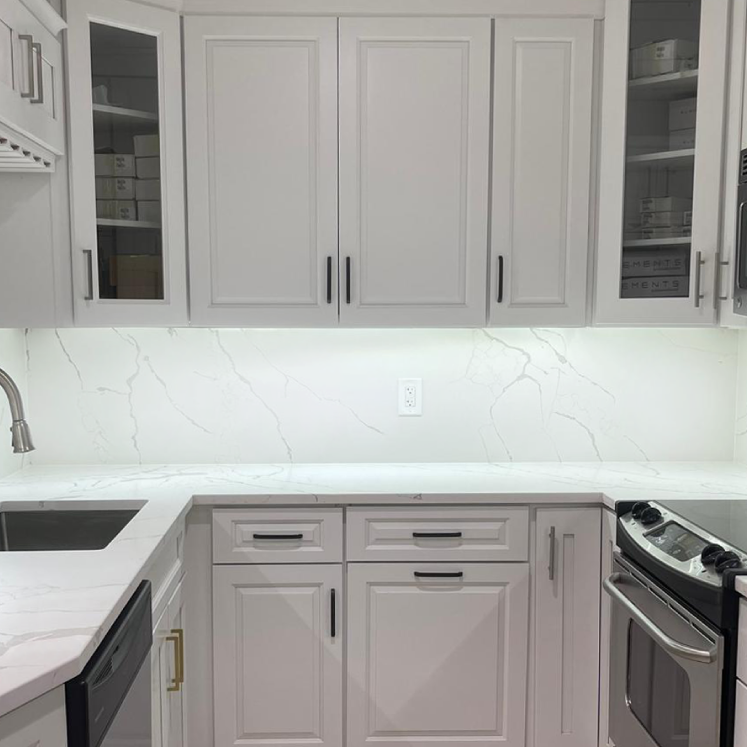 Calacatta Super Bella silica free quartz countertop by Stratus Surfaces in a finished room