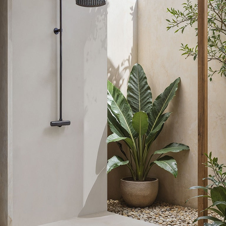 Gris Cemento Matte silica free quartz by Stratus Surfaces on a shower wall