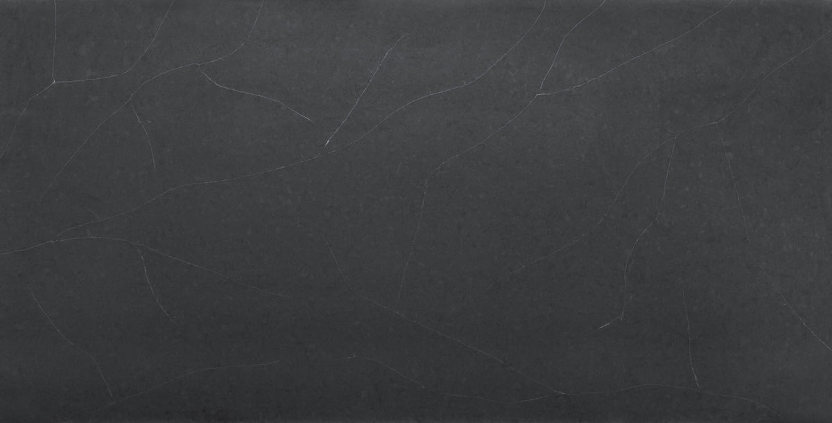 Regal Soapstone Matte silica free quartz slab by Stratus Surfaces, deep charcoal black with white and gray veining, matte finish