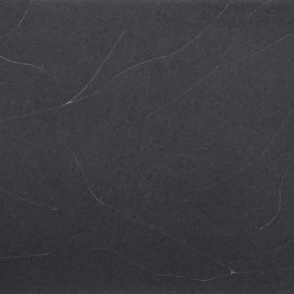 Regal Soapstone silica free quartz slab sample by Stratus Surfaces, deep charcoal black with white and gray veining, polished finish, close up