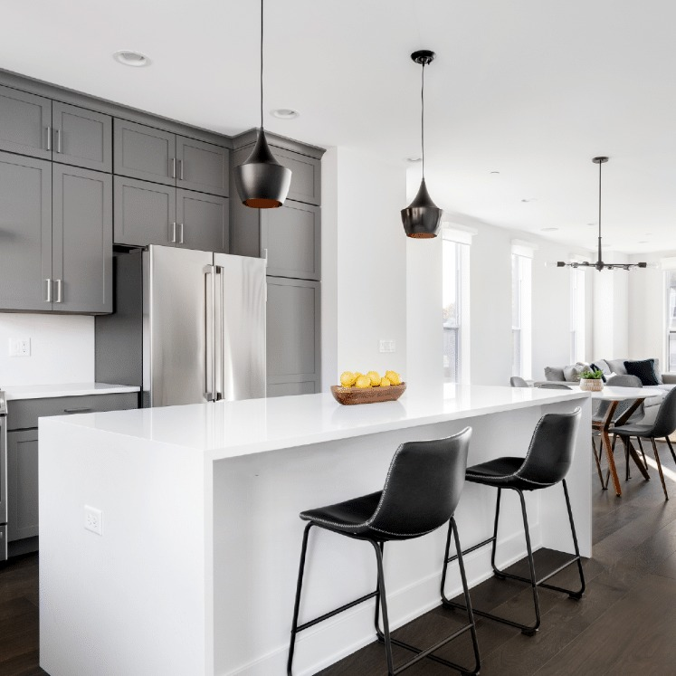 Supreme White silica free quartz countertop by Stratus Surfaces in a finished room