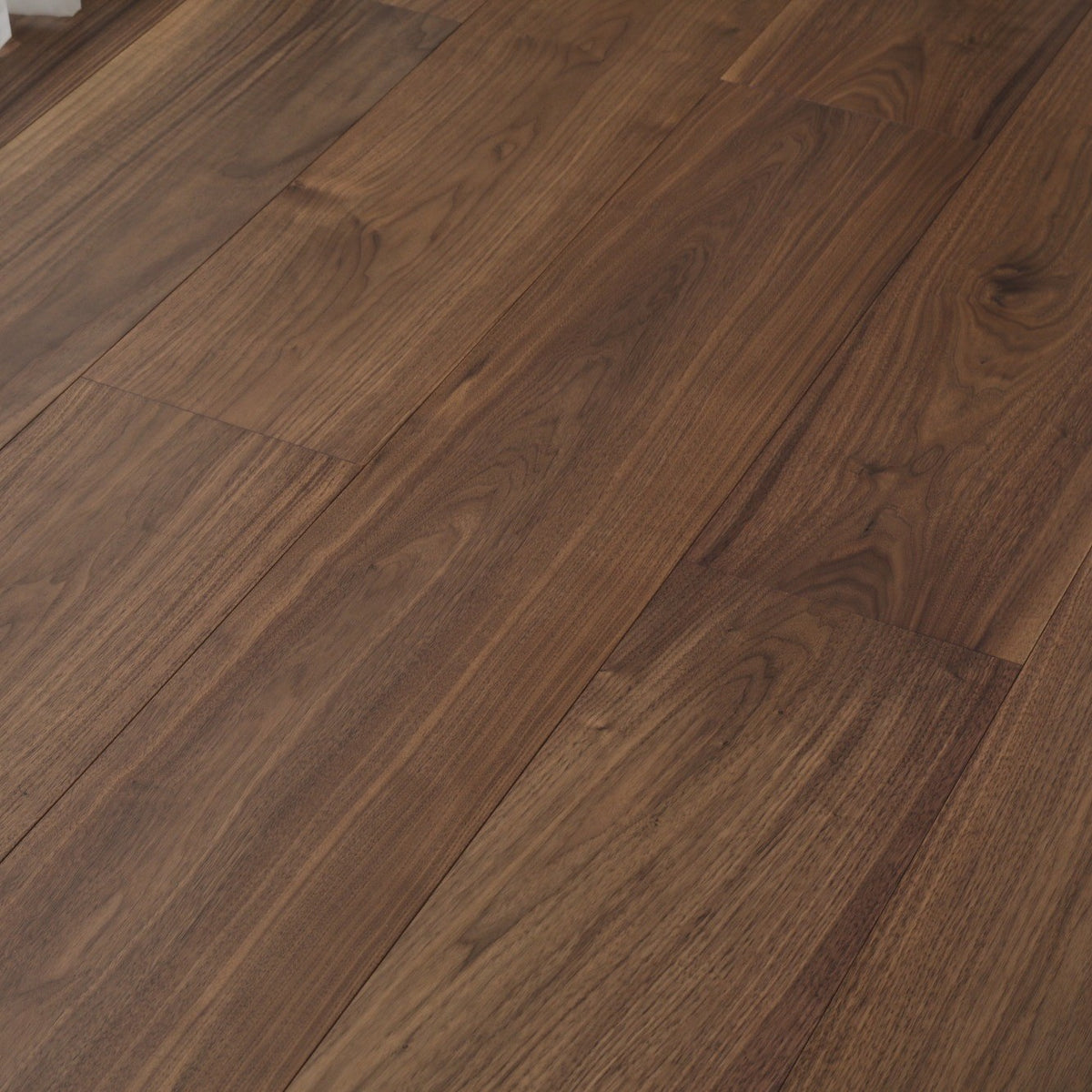 Stella #820 Engineered Wood Flooring in deep chocolate brown American Walnut, close view of the American walnut planks with beveled edges